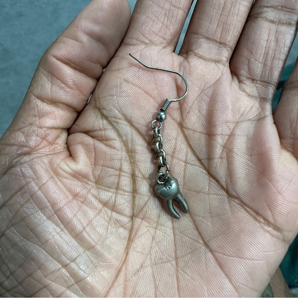 Single tooth 🦷 dangley earring